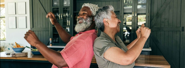 Photo of an African-American man and woman, both high-risk individuals, dancing.