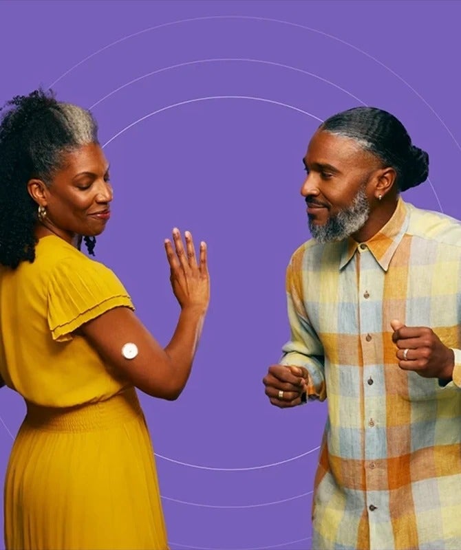 Photo of an African-American man and woman, both high-risk individuals, dancing.