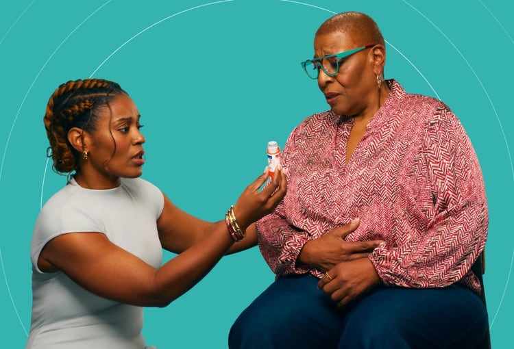 Photo of a young African-American woman helping an older African-American woman with COVID-19 high risk factors with her asthma inhaler.
